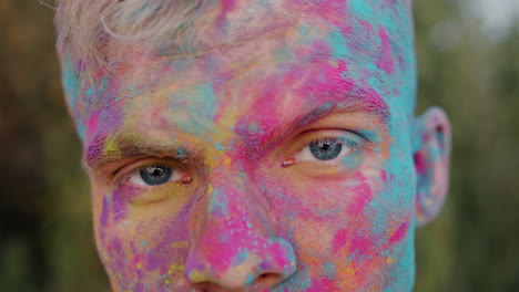 Close-up of a man with colorful face paint