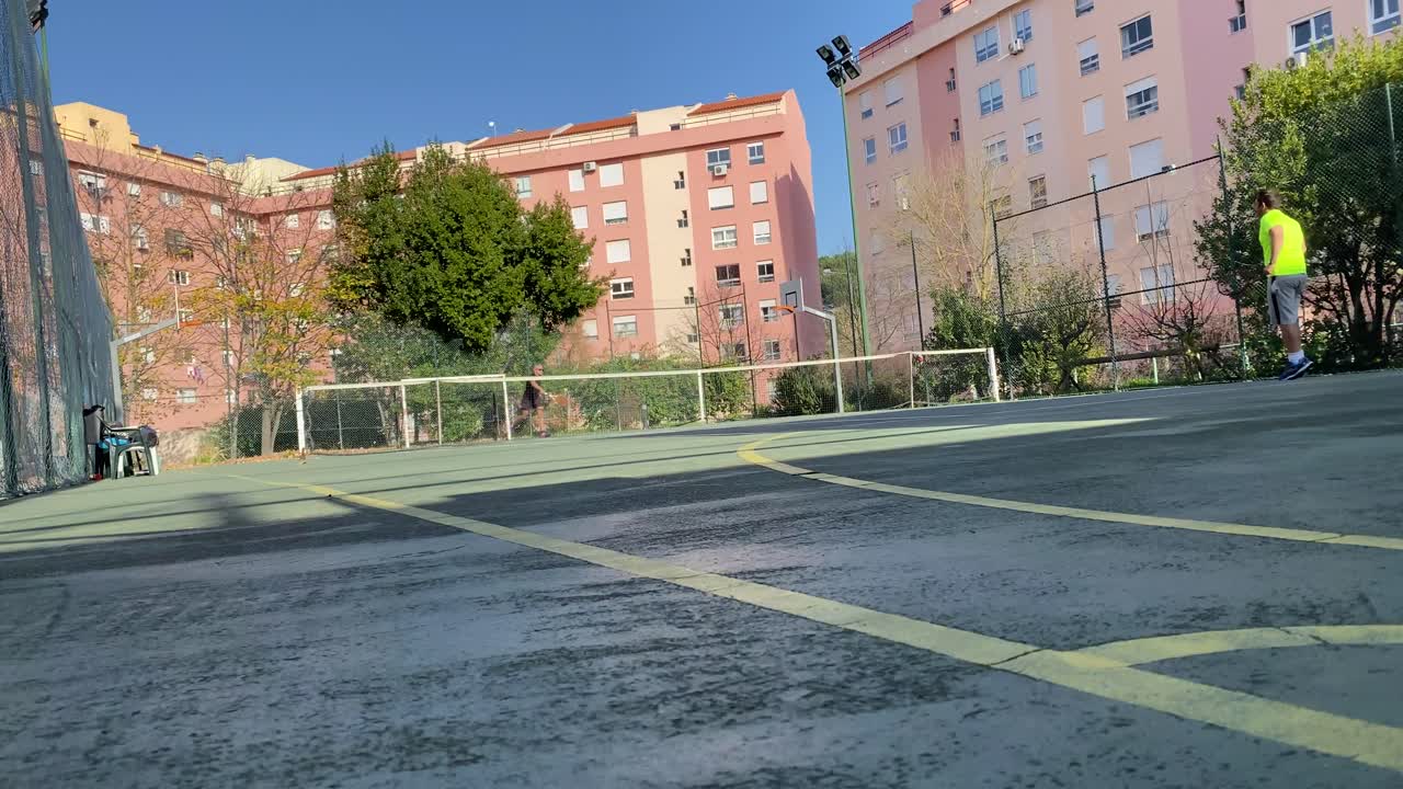 wide view of Tennis Court During A Game in Lisbon