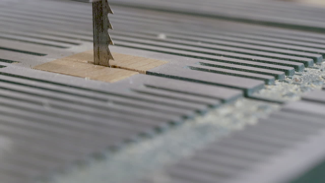 Close-up of a Band Saw Cutting a Small Piece of Wood