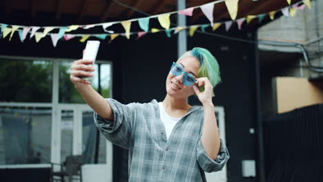 young woman taking a selfie outdoors