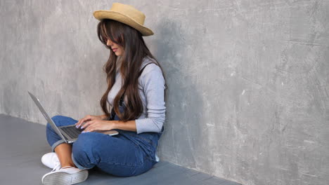 young woman working on laptop