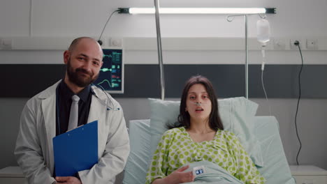 front view of medical specialist and sick woman having online videocall conference