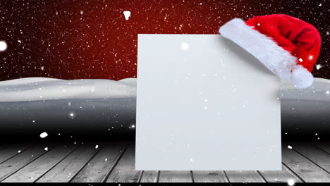 animation of white card with copy space and snow falling with santa claus hat