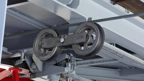 Close-Up-of-Cable-Car-Wheels-and-Steel-Rope-Mechanism-at-Winter-Resort
