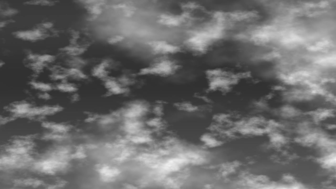 Black and white stylized clouds drift forward through a dark sky in this seamless animation.