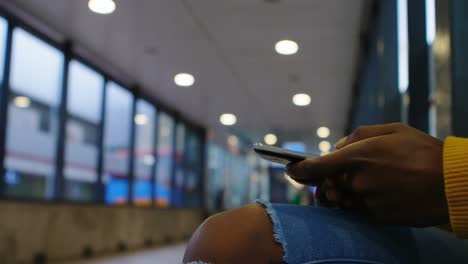 woman using mobile phone in subway 4k