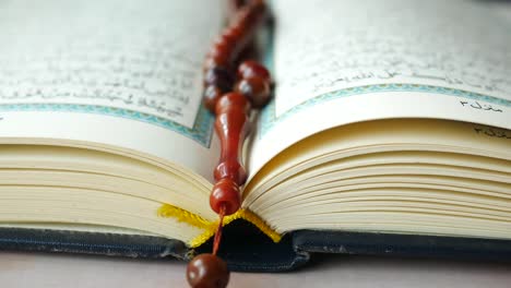 open quran with rosary