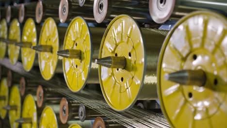 focus becomes clear on bobbins with tire threads closeup