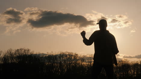 man dancing at sunset