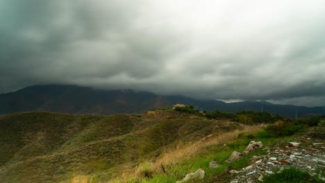 stormy clouds flowing above mountains of estepona, time lapse view