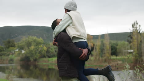 couple, man lifting woman with hug