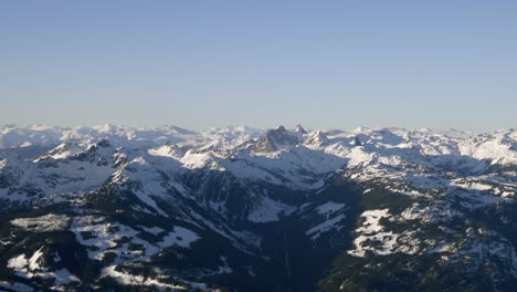 snow covered mountains in bc, canada, aerial shot