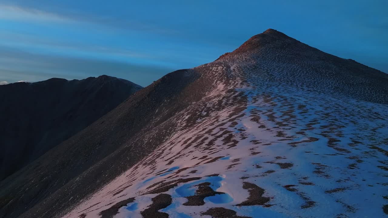 Hike to Mt Mount Shavano Taeguache Peak aerial drone Colorado trail Golden hour sun Rocky Mountains horizon snow dusting 14er Buena Vista Sawatch Range above treelike fall autumn clouds forward pan up