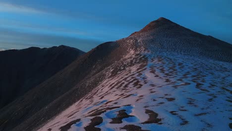 hike to mt mount shavano taeguache peak aerial drone colorado trail golden hour sun rocky mountains horizon snow dusting 14er buena vista sawatch range above treelike fall autumn clouds forward pan up