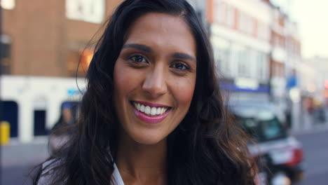 smiling woman in an urban setting