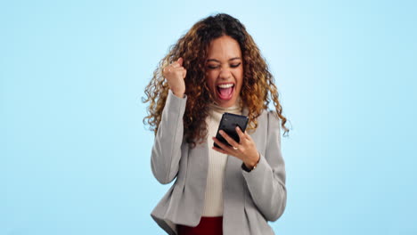 Woman,-phone-and-fist-celebration-in-studio