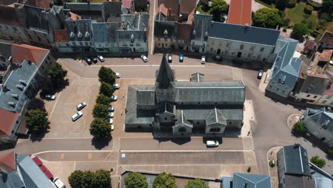 aerial view of a french town square with church