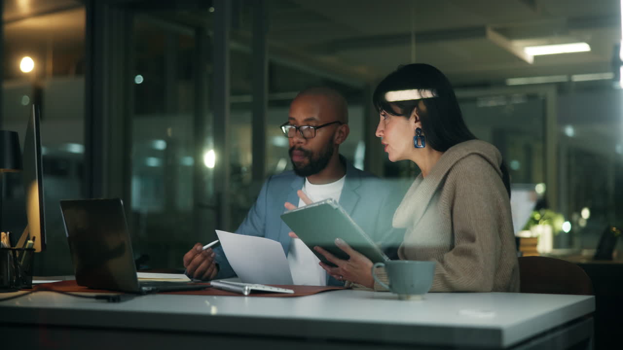 Teamwork in the Office at Night