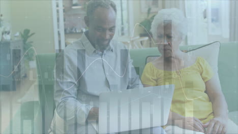 animation of data processing over diverse senior couple using laptop