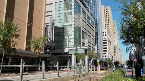 A-rapid-transit-train-moves-quickly-through-downtown-Houston-with-fountains-dancing-1