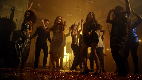 jumping on dance floor covered with confetti