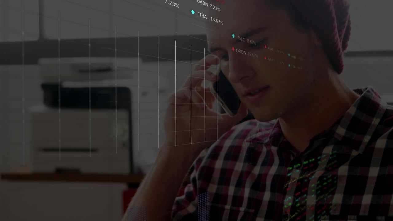 Animation of stock market data processing over caucasian man talking on smartphone at office