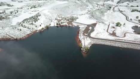 aerial flight over large lake and snow during winter