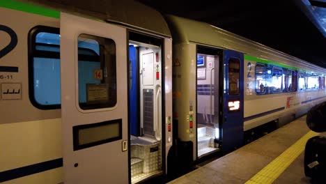 polish train at the stop station with open