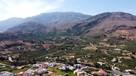 magical crete island landscape with mountains and town, aerial view