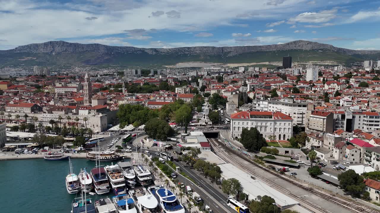 Drone aerial birds eye view split harbour town city croatia cruise ships boats summer blue sky day balkans