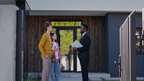 potential home buyers meeting with real estate agent