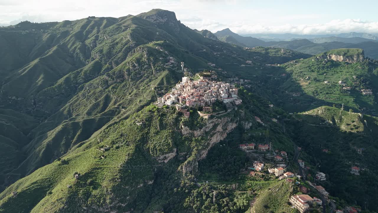 Aerial view of scenic Castelmola village nestled in Sicily's green mountains