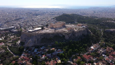 descending aerial shot of the acropolis revealing athens old town