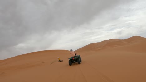 quad biking in the desert on a foggy day