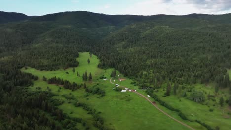 panoramic view of lolo national park with forested mountains and tourists camping in montana, usa