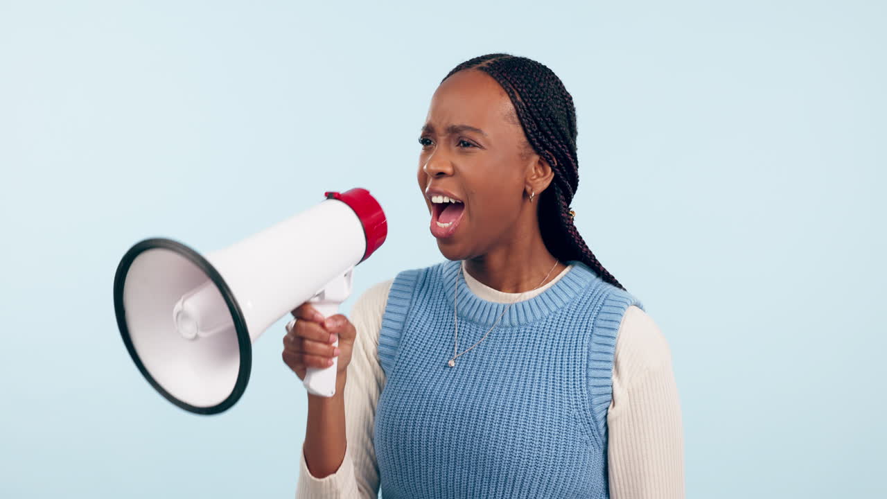 Black woman, megaphone and shouting in protest