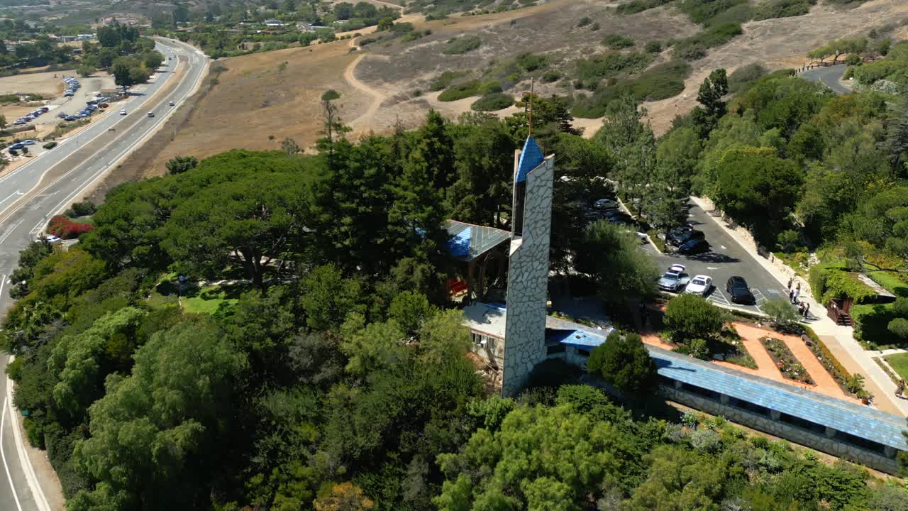 Drone video of Wayfarers Chapel in Palos Verdes California on a bright sunny day.