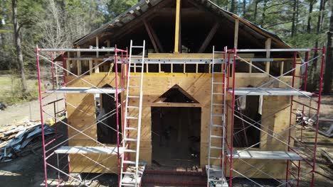 plywood cladded wooden church in disrepair being restored