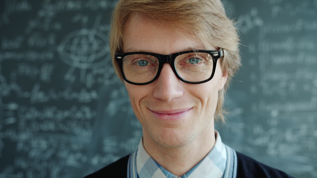 Smiling Man in Glasses, Chalkboard Background