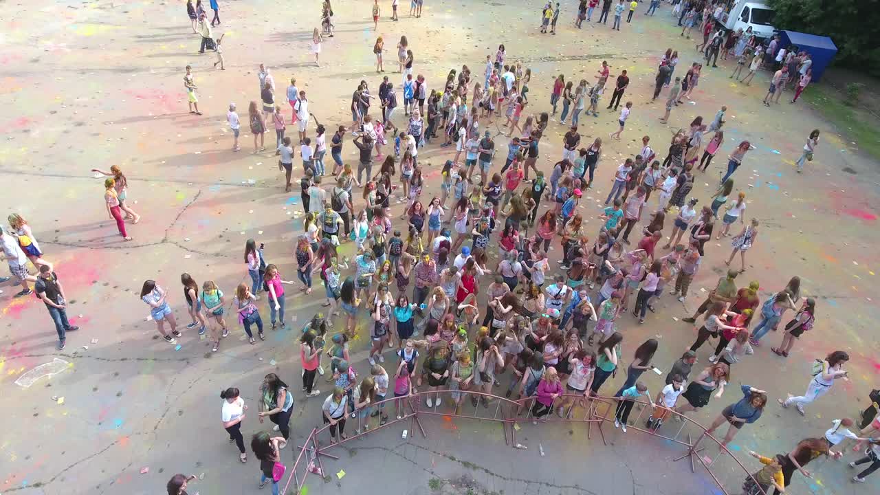 Summer Outdoor Festival. VINNITSA, UKRAINE - JULY 2017: Young people covered with coloured powder during summer outdoor festival