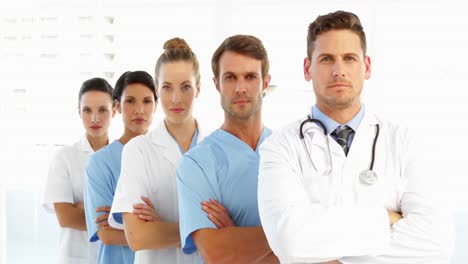 frowning medical team with arms crossed