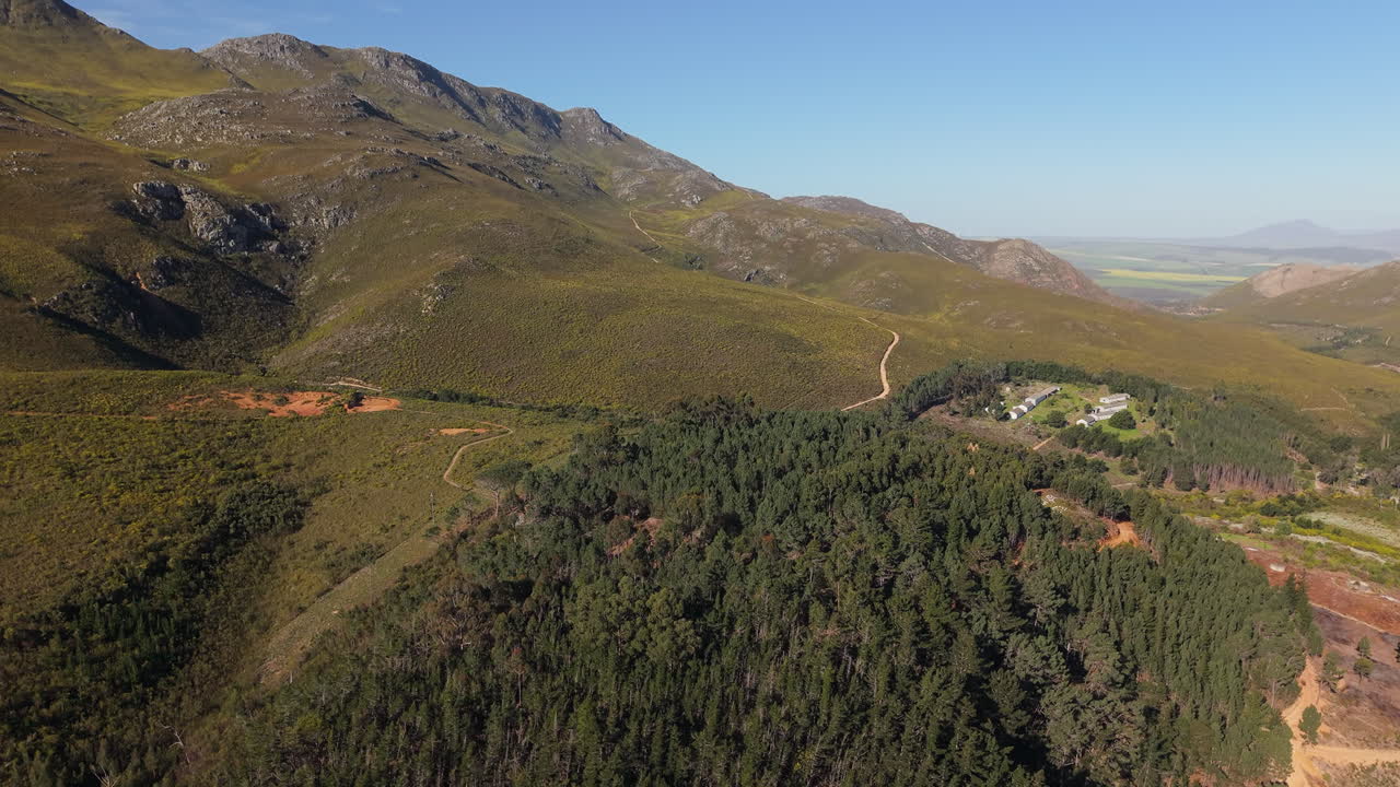 Dense Forest Mountain Ridge In Cape Town, South Africa. Aerial Tilt-up Shot