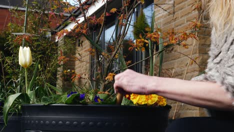 attractive woman working in her garden medium zoom out shot shot slow motion