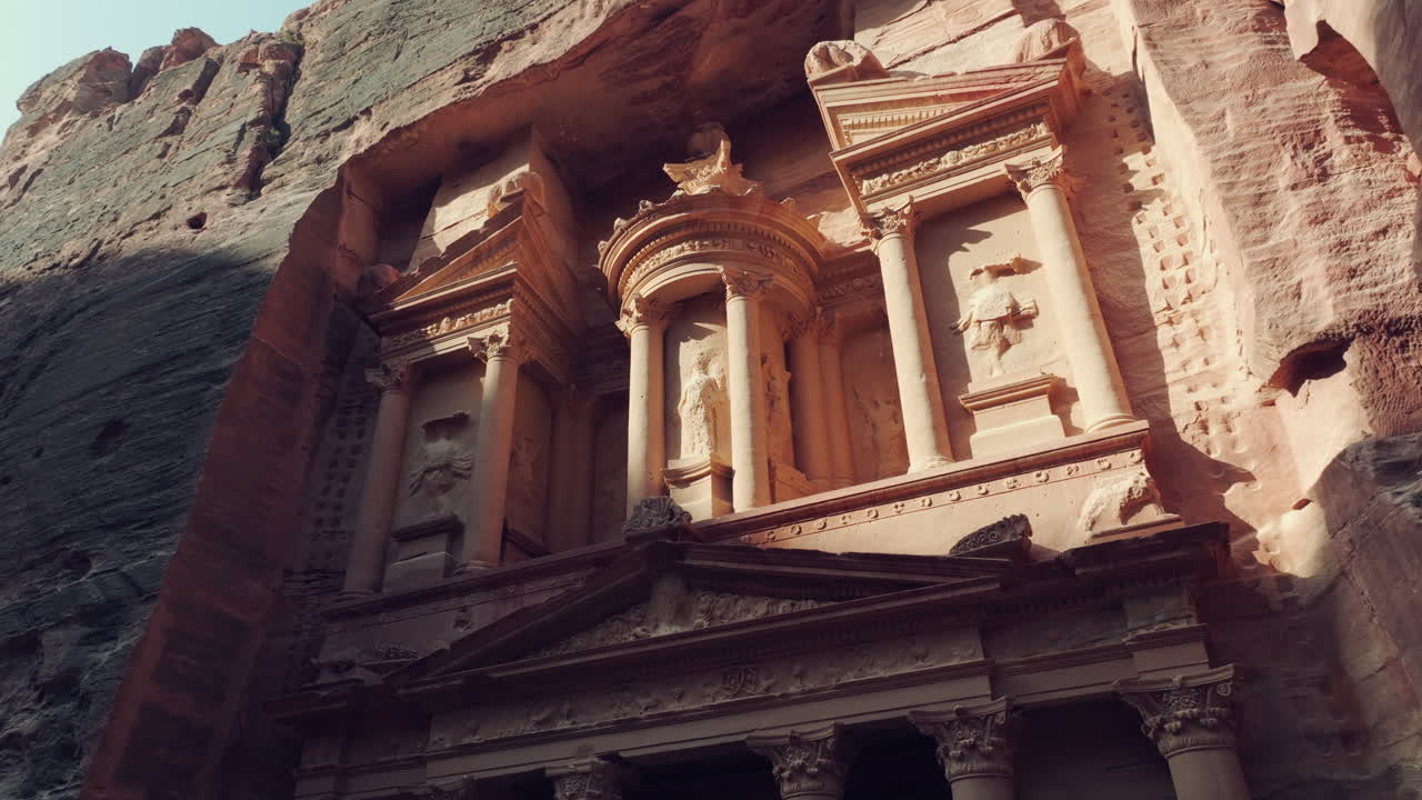 Historic UNESCO world heritage site The Treasury sandstone sculpture carvings, Petra, Low angle view