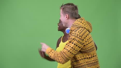 young multi-ethnic couple pointing finger together