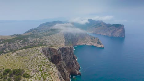 Aerial-view-of-archipelago-mountain-range-near-blue-water-bay,-Mallorca