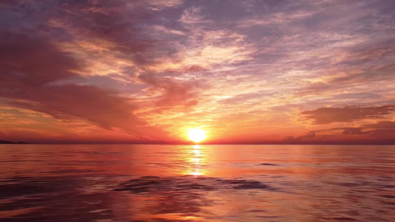 Breathtaking Sunset Over Tranquil Waters: A Scenic View of Dazzling Colors and Serene Reflections Captured at Dusk on the Calm Ocean Surface