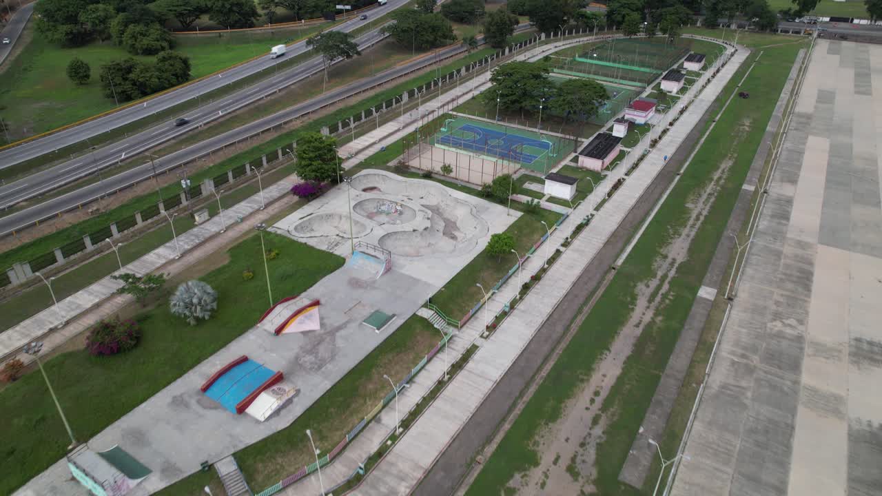 Aerial view tilting up Paseo Bicentenario Aragua, scenic outdoor space