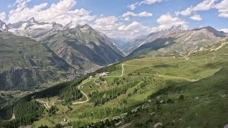 Cable-car-ride-towards-zermatt-town-in-the-valley-at-Swiss-Alps-in-Switzerland,-Europe