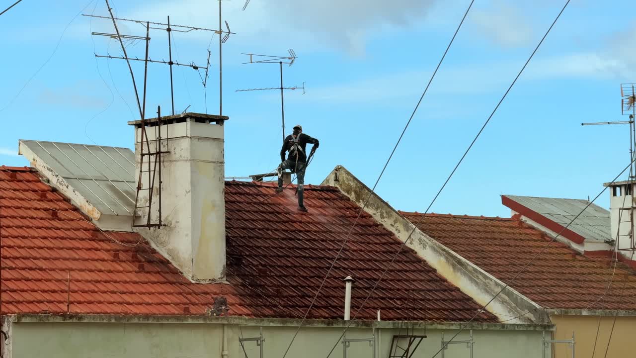 Roof Cleaning by a Worker